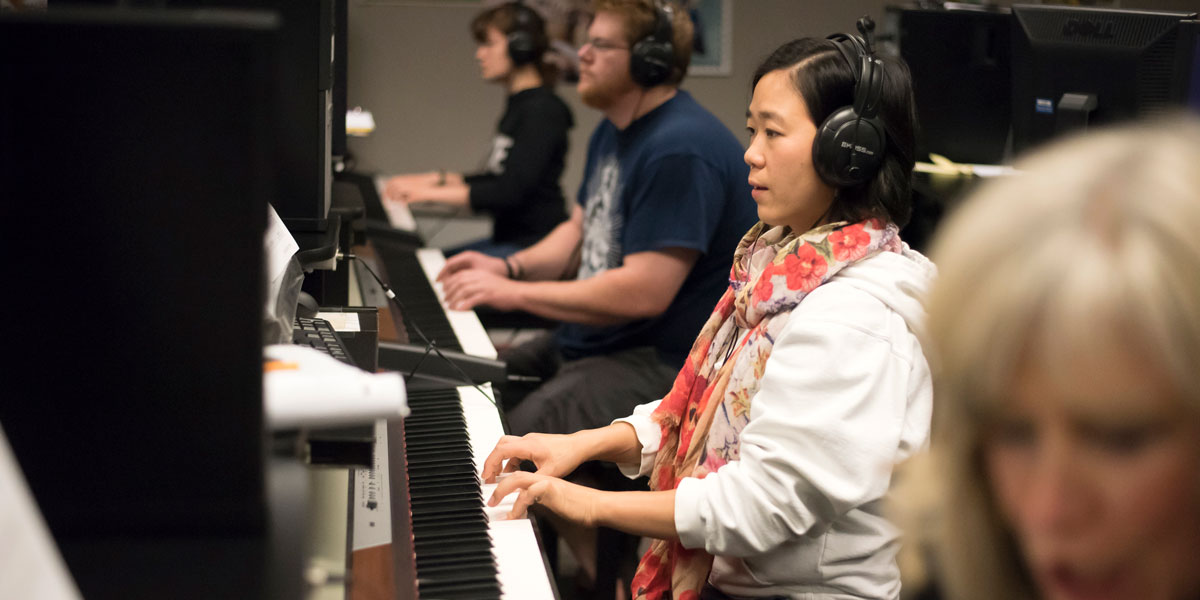 AACC student playing the piano.