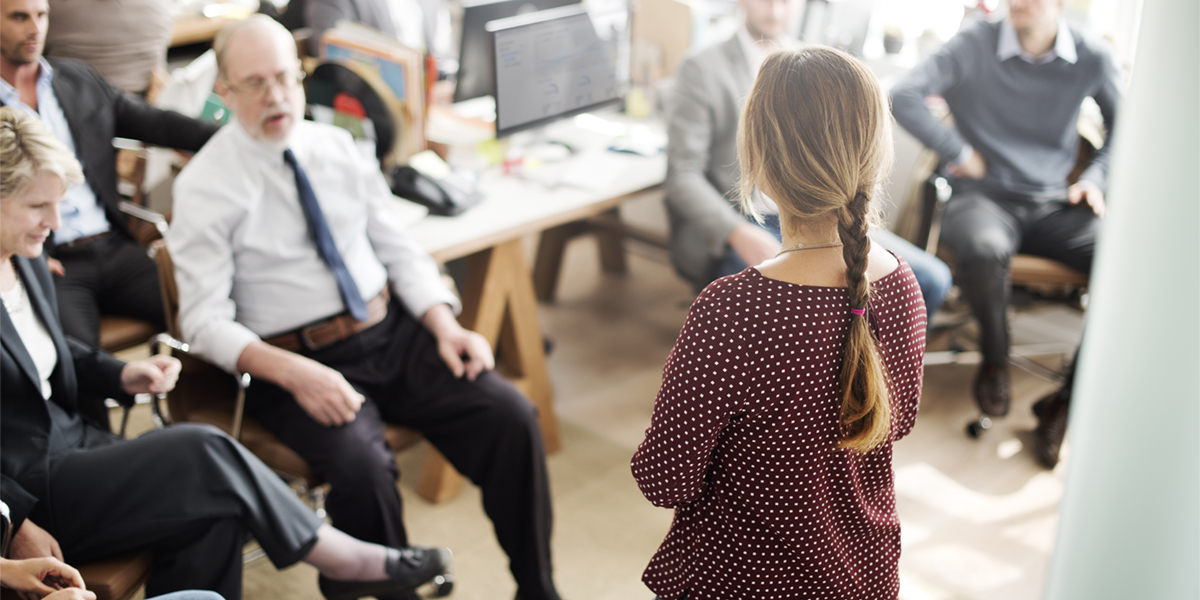 woman/leader speaking to a group