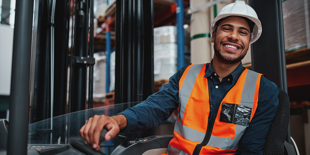 Image of man on forklift.