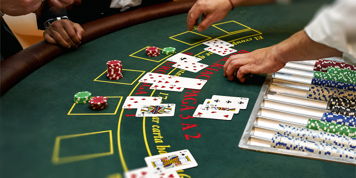 Dealer and players at blackjack table.