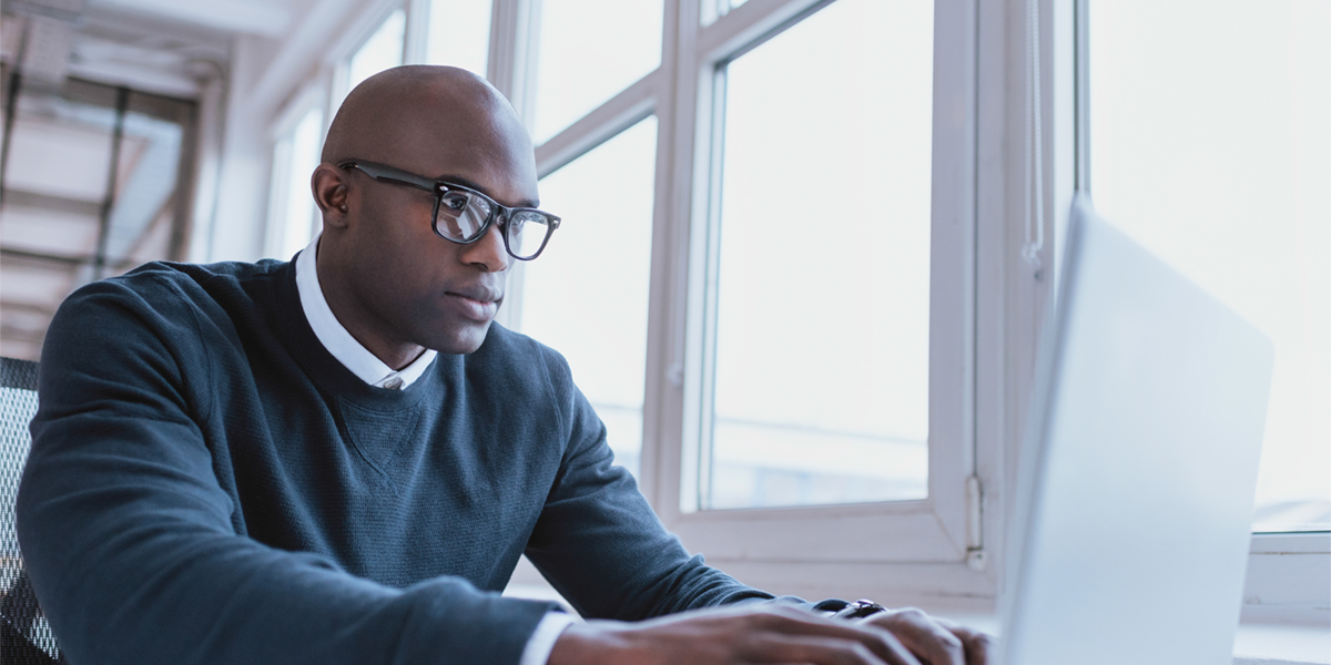 adult male student at laptop