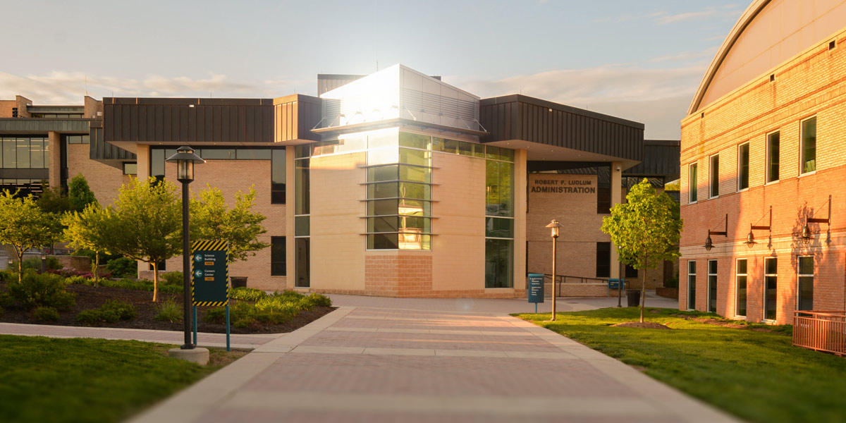 Sun reflects off AACC's Ludlum administration building.