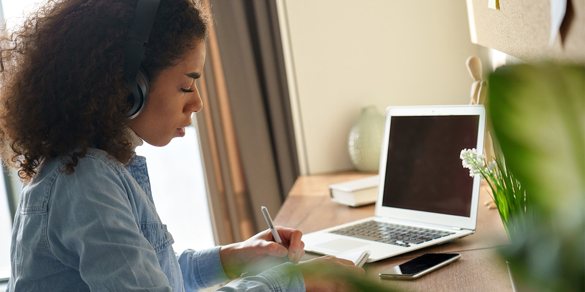 Student studying using a laptop.