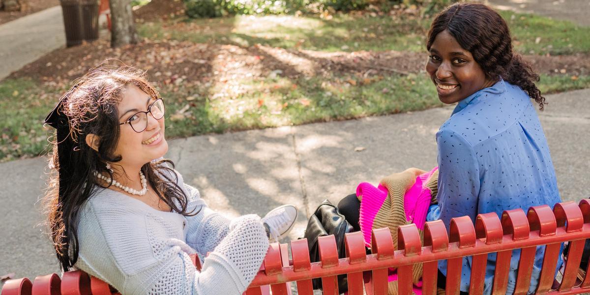 Two AACC students smiling outside.