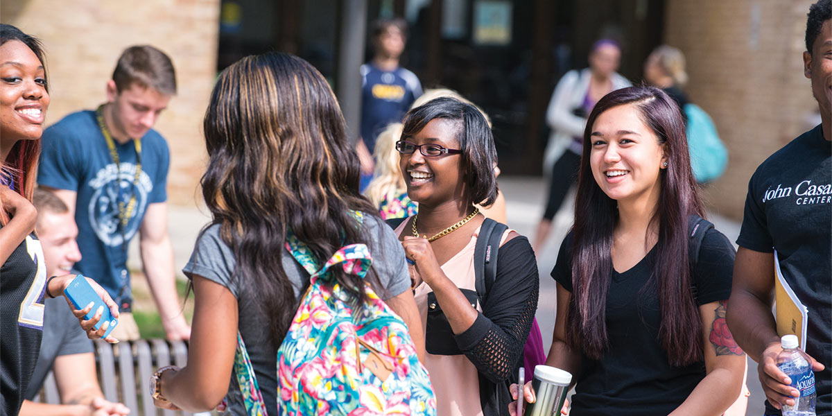 students having casual discussion outdoors